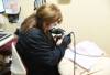 Dental assistant cleaning teeth during a preventive care visit