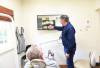Dr. Crabtree reviewing dental X-rays with a patient
