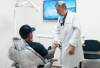 Dr. Maitre greeting a patient in the treatment chair